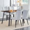 One table and 4 light gray PU chairs. Rectangular tea brown glass dining table, tempered glass tabletop and black metal legs, suitable for kitchen