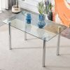 Modern minimalist glass dining table. A transparent tempered glass desktop with a thickness of 0.3 feet and metal legs. Suitable for restaurants and l